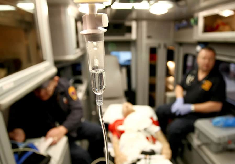 inside an occupied ambulance with IV drip close up