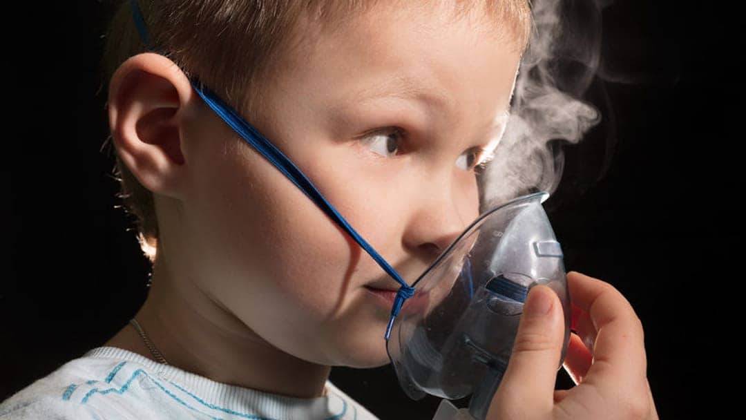 pediatric patient breathing in oxygen