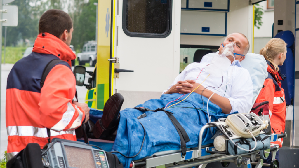 older male patient outside ambulance with oxygen mask on