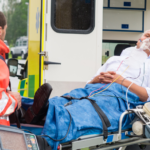 older male patient outside ambulance with oxygen mask on